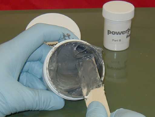 Stirring continues for approximately 3 minutes until the mixture is homogenous and grey in color.