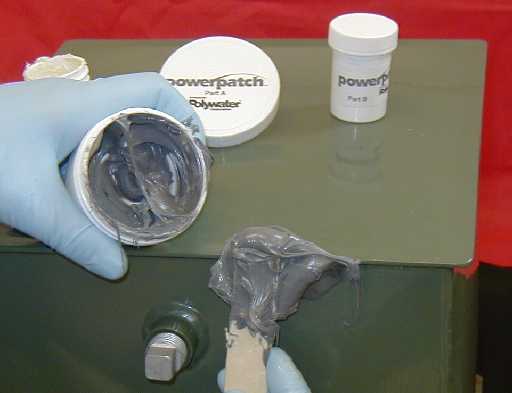 The mixed sealant is applied over and at least a half inch beyond the temporary putty plug to create a hard, permanent seal.