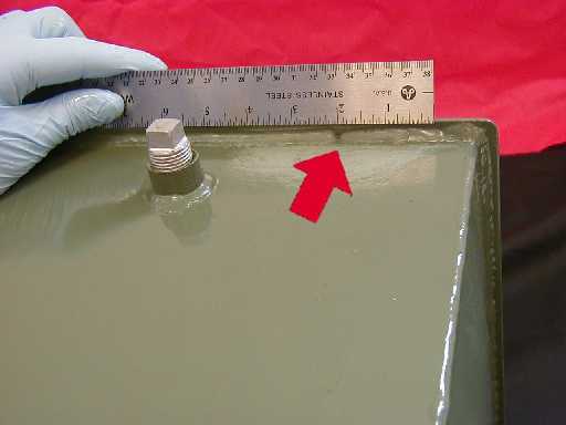 A leak is detected along a welded seam in our mini test transformer.