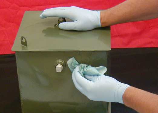 Leaking transformer oil is wiped off the area to be sealed.