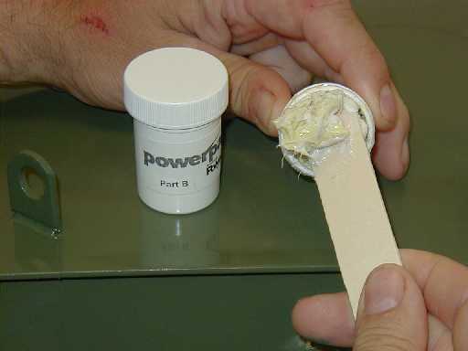 PowerPatch® Curing Agent Part B is opened and any protective top layer or skin is removed and discarded.