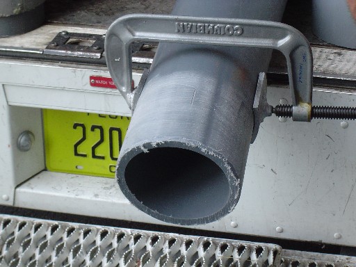 A section of 6-inch polyethylene conduit is lightly sanded in preparation for its connection to a PVC coupler with BonDuit® Adhesive.