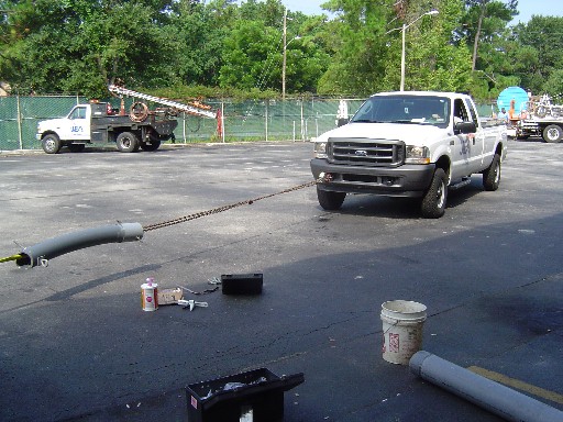 ... and the other end is attached to a Ford F-250 3/4-ton pickup truck. After only 45 minutes of adhesive curing time the truck eases back and begins trying to pull the components apart.
