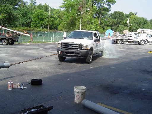 Check out the rear tires smoking on the truck as it fails to break the BonDuit® seal!