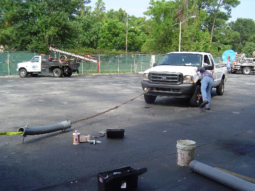 Eventually they had to put the truck in 4-wheel drive to make the coupler and pipe separate. An attached dynamometer only read to 4000 lbs. of tension, which was exceeded, so the actual pull-out strength is unknown but estimated to be 7,000 lbs. Tensile strength after 24 hours of curing could reach 10,000 lbs. on 6-inch duct. This demo was deemed a smash success by an impressed work crew.