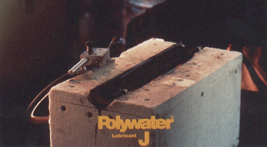 All of the wax, wax/soap, and polymer-type lubricants tested had residues significantly more combustible then fire-retardant cable jacket. Only one lubricant tested, Polywater® J, showed little tendency to burn or spread fire. Polywater® J was less combustible than the fire-retardant cable jacket control!.