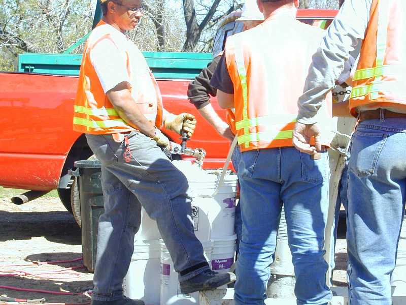 An electric or battery-operated drill is attached to the pump.